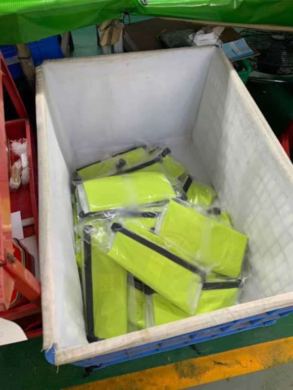 Cloth-lined turnover bins holding individually bagged finished products